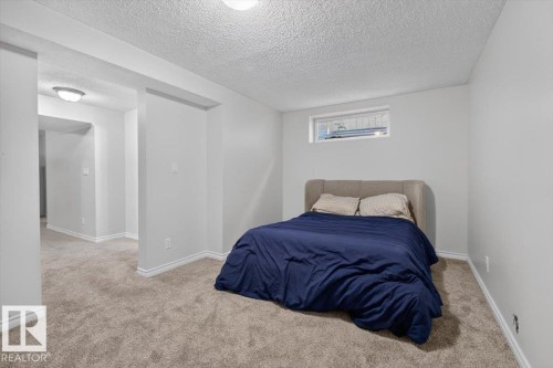Recessed window and light-toned walls - 722 88A Street Sw, Edmonton, AB - Indoor Photo Showing Bedroom