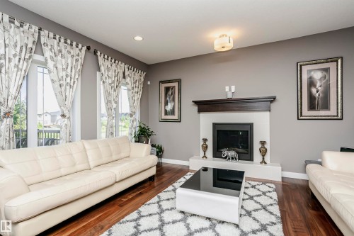 15848 13 Avenue Sw, Edmonton, AB - Indoor Photo Showing Living Room With Fireplace