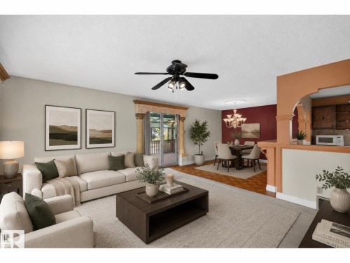 Open-concept living space featuring light-toned walls - 6348 34A Avenue Nw, Edmonton, AB - Indoor Photo Showing Living Room