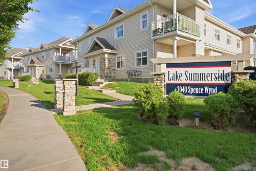 Entry sign for Lake Summerside at 3040 Spence Wynd, featuring stacked stone pillars and a dark blue sign face - #95 3040 Spence Wd Sw, Edmonton, AB - Outdoor With Facade