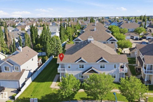 Multi-story residence featuring light gray siding, multiple gabled rooflines, and white-trimmed windows - #95 3040 Spence Wd Sw, Edmonton, AB - Outdoor With View
