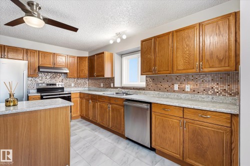 7704 152B Avenue Nw, Edmonton, AB - Indoor Photo Showing Kitchen With Double Sink