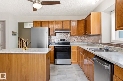 7704 152B Avenue Nw, Edmonton, AB - Indoor Photo Showing Kitchen With Double Sink