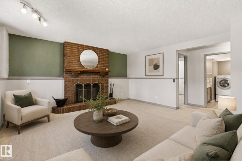 7704 152B Avenue Nw, Edmonton, AB - Indoor Photo Showing Living Room With Fireplace