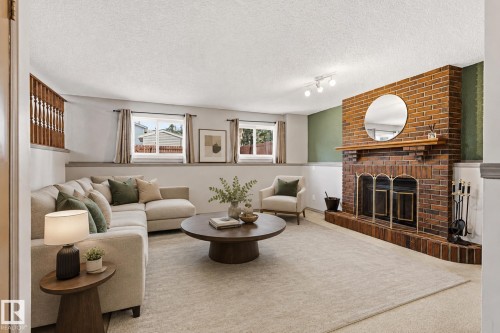 7704 152B Avenue Nw, Edmonton, AB - Indoor Photo Showing Living Room With Fireplace