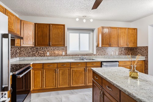 7704 152B Avenue Nw, Edmonton, AB - Indoor Photo Showing Kitchen With Double Sink