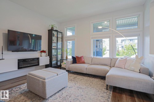 1921 Kroetsch Crescent Sw, Edmonton, AB - Indoor Photo Showing Living Room With Fireplace