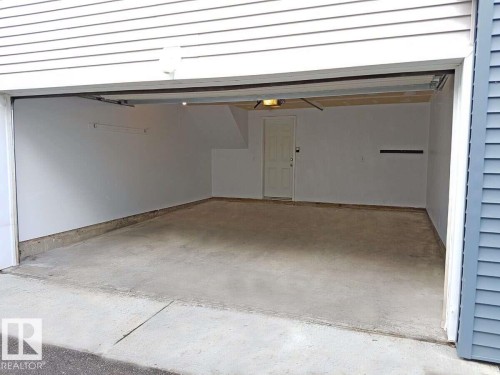#15 8304 11 Av Sw, Edmonton, AB - Indoor Photo Showing Garage