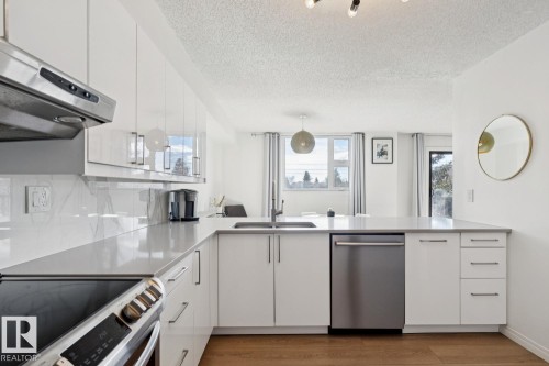 #401 10545 Saskatchewan Dr Nw, Edmonton, AB - Indoor Photo Showing Kitchen With Double Sink With Upgraded Kitchen