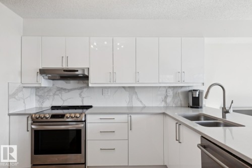 #401 10545 Saskatchewan Dr Nw, Edmonton, AB - Indoor Photo Showing Kitchen With Double Sink With Upgraded Kitchen