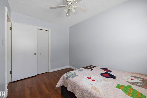 Wood-finish flooring with white trim - 3511 73 Street Nw, Edmonton, AB 