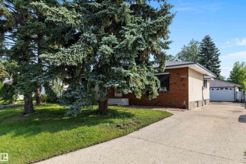 Brick ranch home situated on a mature, tree-lined lot with expansive lawn - 3511 73 Street Nw, Edmonton, AB 