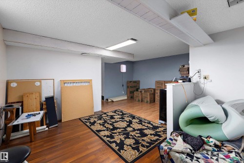 Recessed lighting, wood-finish flooring, and white painted walls - 3511 73 Street Nw, Edmonton, AB 