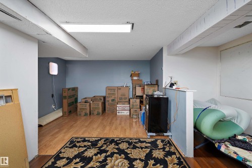 Wood-finish flooring with recessed ceiling lighting - 3511 73 Street Nw, Edmonton, AB 