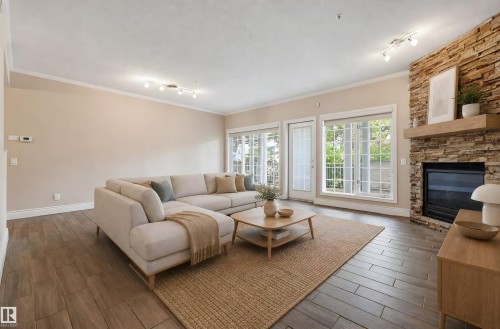 #108 11650 79 Av Nw, Edmonton, AB - Indoor Photo Showing Living Room With Fireplace