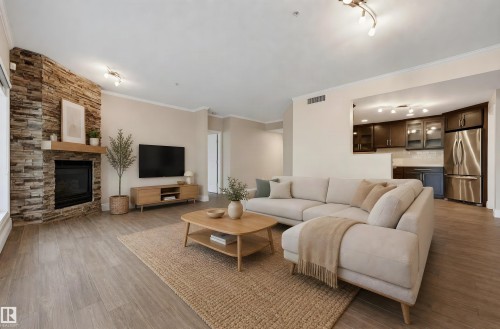 #108 11650 79 Av Nw, Edmonton, AB - Indoor Photo Showing Living Room With Fireplace