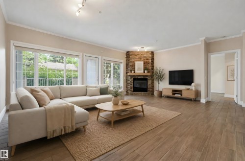 #108 11650 79 Av Nw, Edmonton, AB - Indoor Photo Showing Living Room With Fireplace