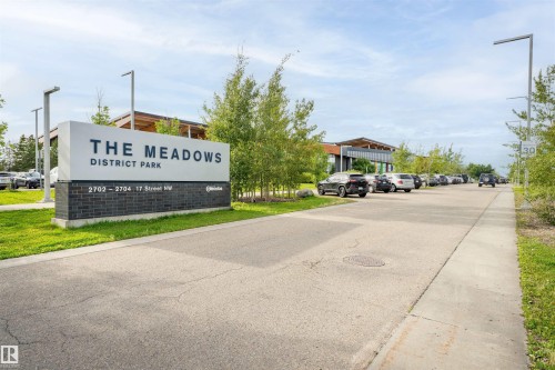Modern district park signage with stone-look base - 1172 Aster Boulevard Nw Nw, Edmonton, AB - Outdoor