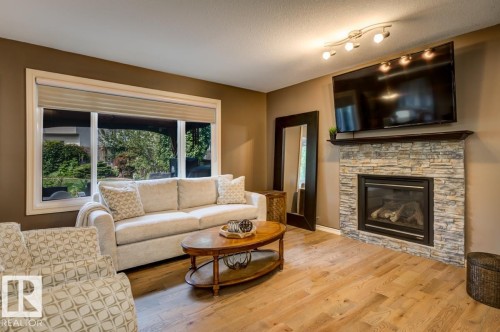 854 Chahley Way Nw, Edmonton, AB - Indoor Photo Showing Living Room With Fireplace