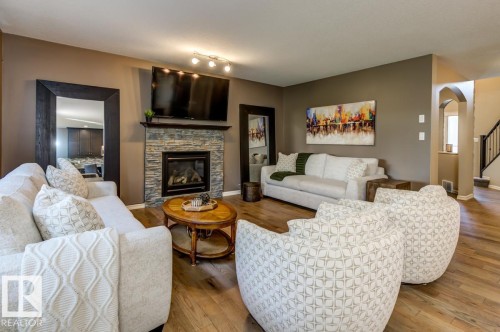 854 Chahley Way Nw, Edmonton, AB - Indoor Photo Showing Living Room With Fireplace