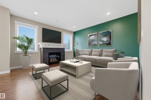93 Sheppard Way, Leduc, AB - Indoor Photo Showing Living Room With Fireplace
