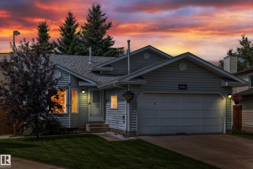Light gray siding exterior with a shingled roof - 2404 37 Street Nw, Edmonton, AB - Outdoor