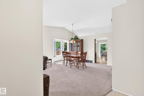 Vaulted ceiling, large windows, and carpeted flooring - 2404 37 Street Nw, Edmonton, AB - Indoor