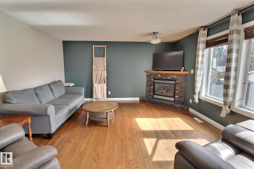 10 Birchmont Crescent, Leduc, AB - Indoor Photo Showing Living Room With Fireplace