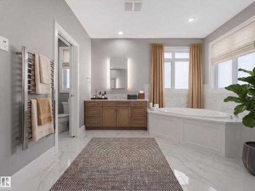 Virtually staged - Spacious bathroom featuring a built-in soaking tub, a large vanity with integrated sink, and white marble-look flooring - 8927 120 Street Nw, Edmonton, AB - Indoor Photo Showing Bathroom