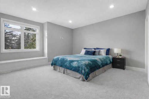 Neutral wall color, recessed lighting, and light-toned carpeting - 8927 120 Street Nw, Edmonton, AB - Indoor Photo Showing Bedroom