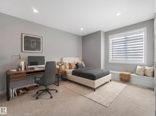 Recessed lighting, light-colored carpeting, built-in window bench, large window with blinds, and a wood-finish desk - 8927 120 Street Nw, Edmonton, AB - Indoor