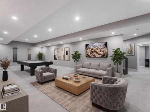Spacious recreational area featuring recessed lighting, light-toned carpeting, and a built-in staircase - 8927 120 Street Nw, Edmonton, AB - Indoor