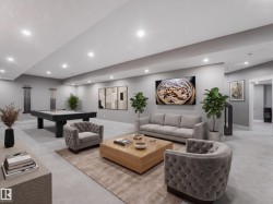 Spacious recreational area featuring recessed lighting, light-toned carpeting, and a built-in staircase - 