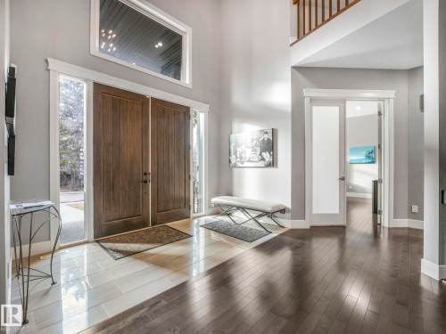 Grand entryway featuring double wood doors and a transom window - 8927 120 Street Nw, Edmonton, AB - Indoor Photo Showing Other Room