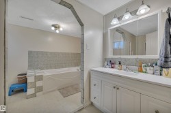 Double vanity with white cabinetry and integrated sink - 