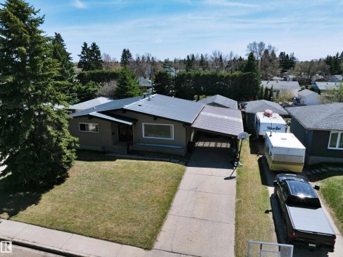 Front-facing residence with a carport and an extended driveway - 5411 44 Ave, Wetaskiwin, AB - Outdoor