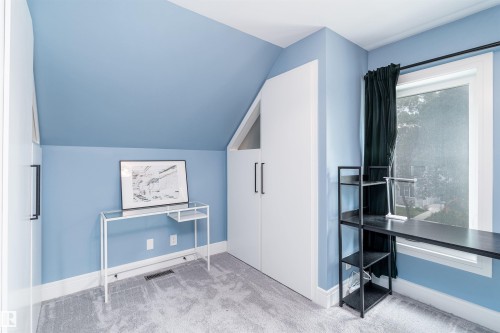 Room featuring light blue walls, sloped ceiling, and plush gray carpeting - 10934 80 Avenue Nw, Edmonton, AB - Indoor Photo Showing Other Room