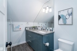 Modern vanity featuring a sleek countertop, integrated rectangular sink, and chrome-finish faucet - 