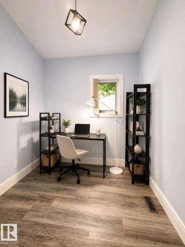 Room featuring light blue walls, wood-finish flooring, and white baseboards - 10934 80 Avenue Nw, Edmonton, AB - Indoor Photo Showing Office