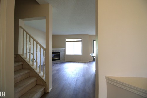 #26 13403 Cumberland Rd Nw, Edmonton, AB - Indoor Photo Showing Other Room With Fireplace