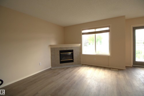 #26 13403 Cumberland Rd Nw, Edmonton, AB - Indoor Photo Showing Living Room With Fireplace