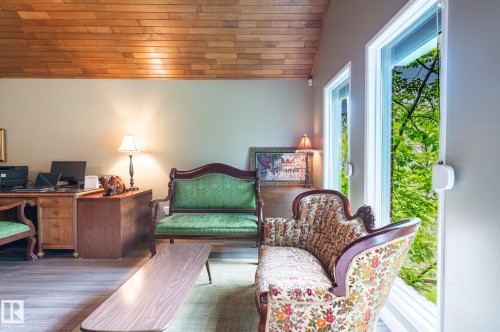 Vaulted wood-plank ceiling complemented by light wood-finish flooring - 14514 101 Avenue Nw, Edmonton, AB - Indoor