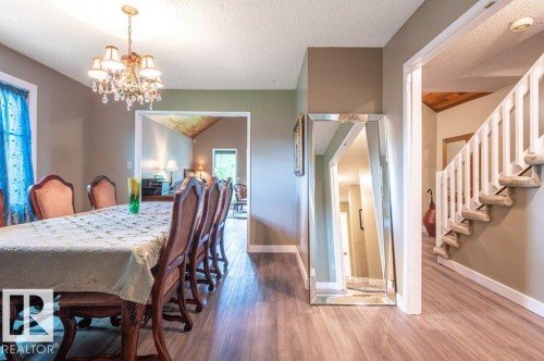 Formal dining area with wood-finish flooring - 14514 101 Avenue Nw, Edmonton, AB - Indoor Photo Showing Dining Room