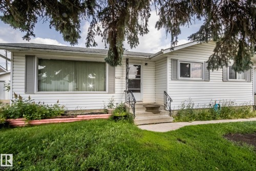 White siding exterior with grey window shutters - 4322 49 Ave, St. Paul Town, AB - Outdoor