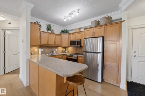 #303 8631 108 St Nw, Edmonton, AB - Indoor Photo Showing Kitchen With Stainless Steel Kitchen With Double Sink