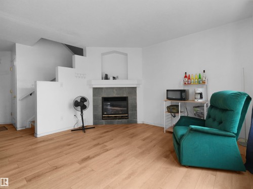 #9 16933 115 St Nw, Edmonton, AB - Indoor Photo Showing Living Room With Fireplace
