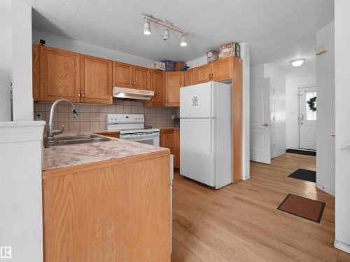 #9 16933 115 St Nw, Edmonton, AB - Indoor Photo Showing Kitchen With Double Sink