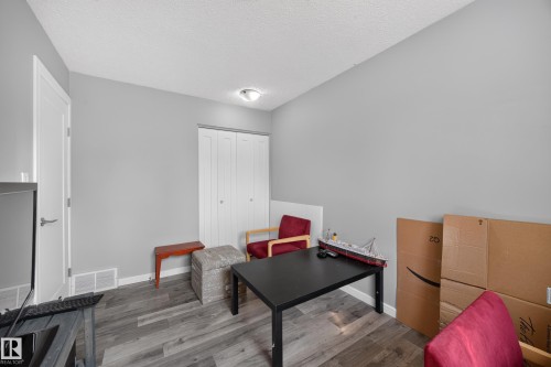 Wood-finish flooring with light gray walls and white trim - 156 Clareview Road Nw, Edmonton, AB - Indoor