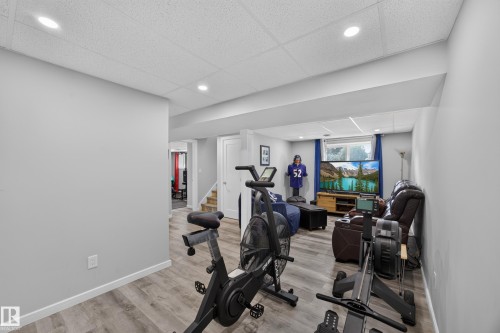 Recessed lighting, wood-finish flooring, light gray wall paint, white trim, and a drop ceiling - 156 Clareview Road Nw, Edmonton, AB - Indoor Photo Showing Gym Room