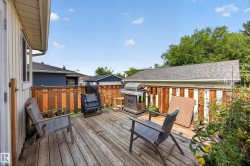 Spacious wood deck with a privacy fence and garden area - 